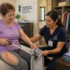 occupational therapist helping resident with daily activities post-hip surgery Pasadena